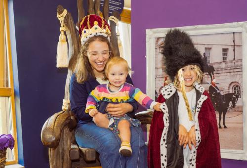 Family posing in Royal family themed dress up